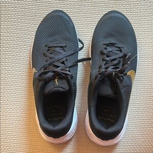 Nike Black and Gold Sneakers with Cushioned Sole